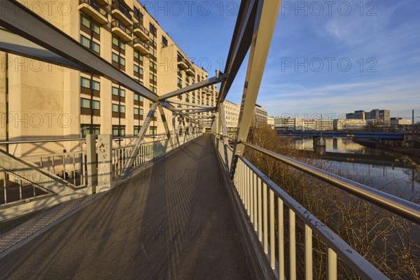 Modern architecture, footbridge, metal railing, river Saar, blue sky, cirrostratus clouds, evening