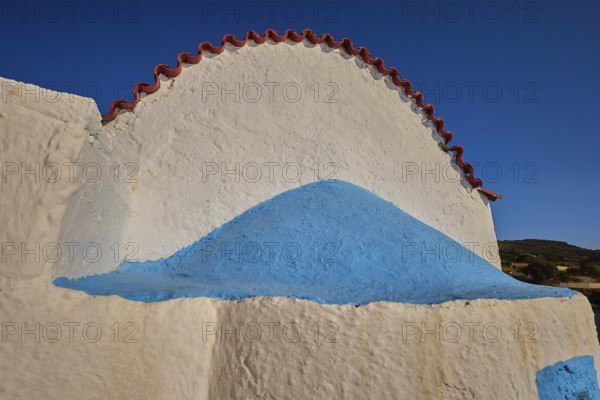 Close-up of a white church vault with blue accents under a blue sky, chapel, church, Agios