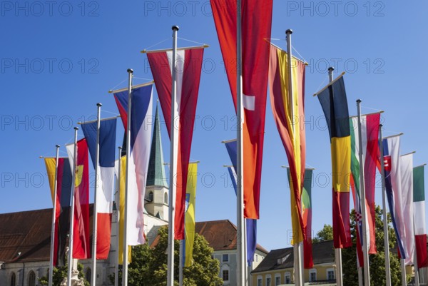 National flags at Kapellplatz with the collegiate parish church of St Philip and St James, place of
