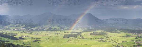Panorama from Grünten over the Illertal with rainbow to Blaichach and Immenstadt, behind