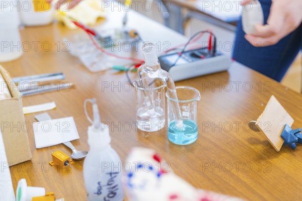 Chemistry laboratory with various laboratory equipment and liquid on the table, Battery Research,
