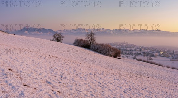 Village in the fog and in the light of dusk, behind the Rigi, Hohenrain, Seetal, Canton Lucerne,