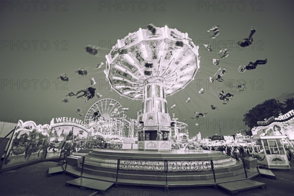Sepia photograph of a merry-go-round at a funfair in motion, merry-go-round, spring festival,