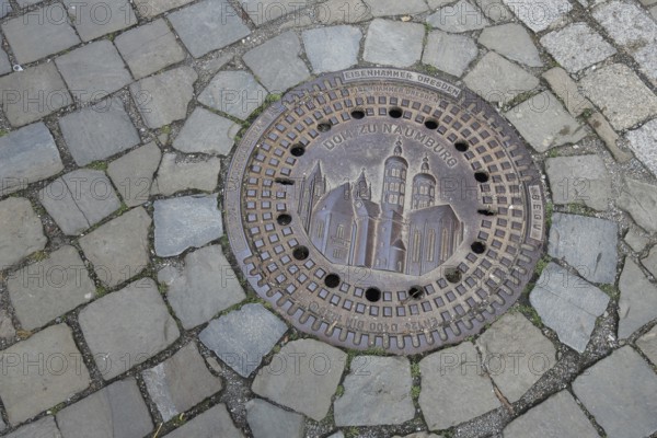Manhole cover with cathedral as landmark, cobblestones, floor, inscription, cathedral square,