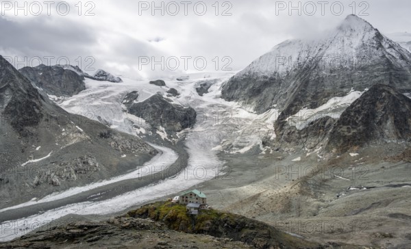 Mountain hut Cabane des Dix in front of glacier Glacier de Cheilon and summit Mont Blanc de