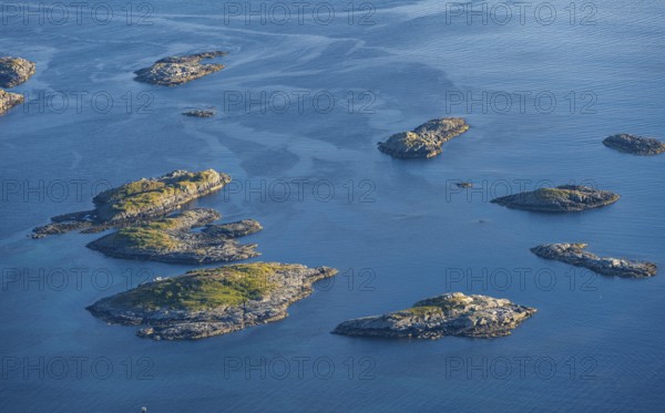 Small rocky islands in the sea, archipelago islands, near Henningsvær, Vågan, Lofoten, Nordland,