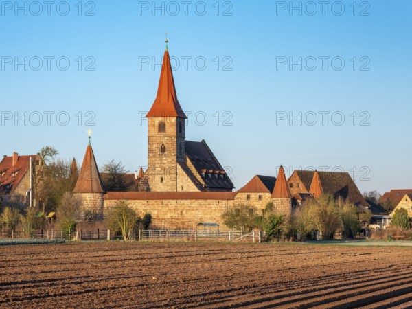 The medieval fortified church of St. George in the district of Kraftshof, Nuremberg, Middle