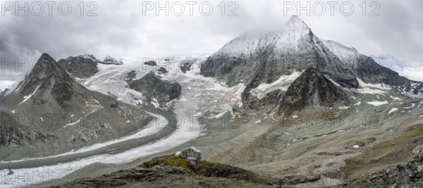 Mountain hut Cabane des Dix in front of glacier Glacier de Cheilon and summit Mont Blanc de