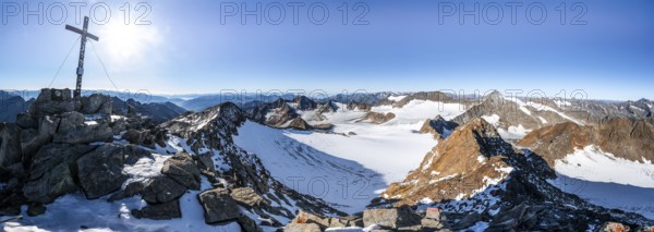 Mountain panorama at the Wilder Freiger summit with summit cross, picturesque high mountain
