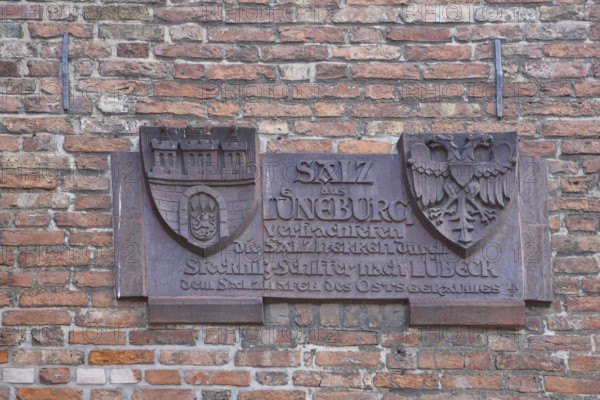City coat of arms with inscription on the history of the city on the historical trade in salt, by