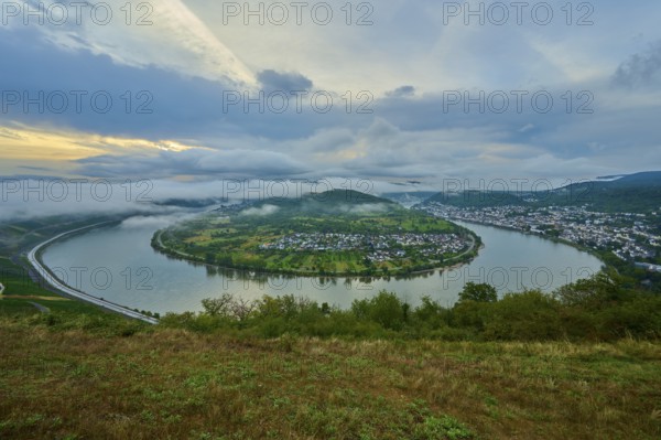 Panoramic view over river and valley, amidst hills in twilight and clouds, summer, Rhine bend