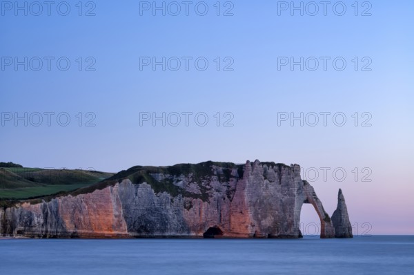 Rock arch Falaise or Porte d'Aval and rock needle Aiguille, illuminated, illuminated, Étretat, sea,
