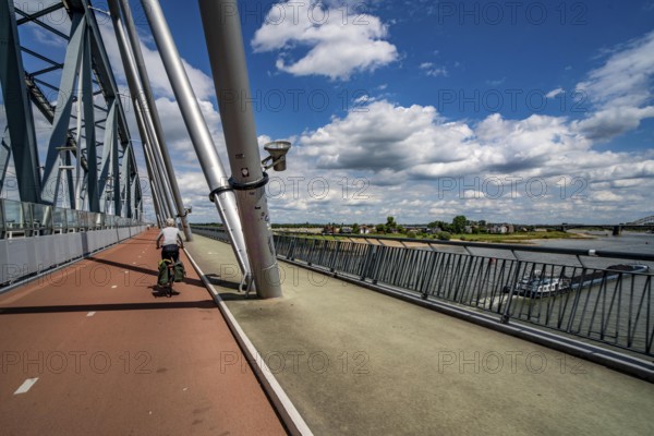 Ride over the Snelbinder Brug bicycle and pedestrian bridge, over the river Waal near Nijmegen, was