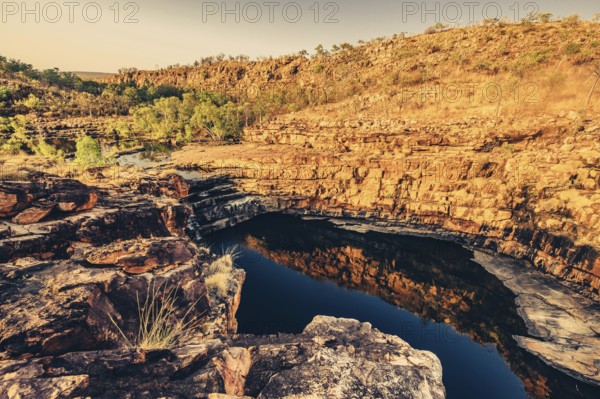 Bell Gorge waterfall, a body of water in north-west Australia in the Kimberley. Sunrise in the