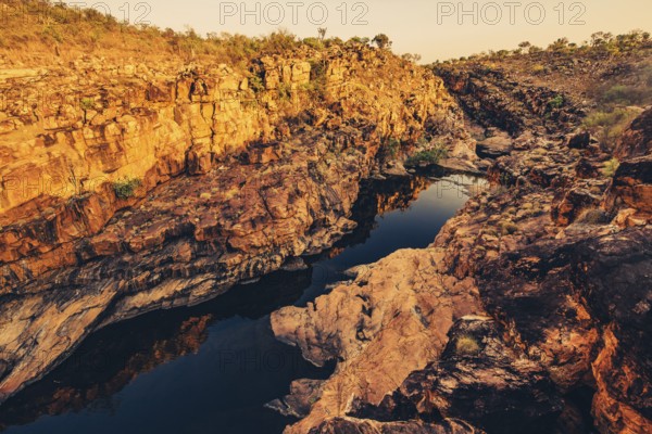 Bell Gorge waterfall, a body of water in north-west Australia in the Kimberley. Sunrise in the