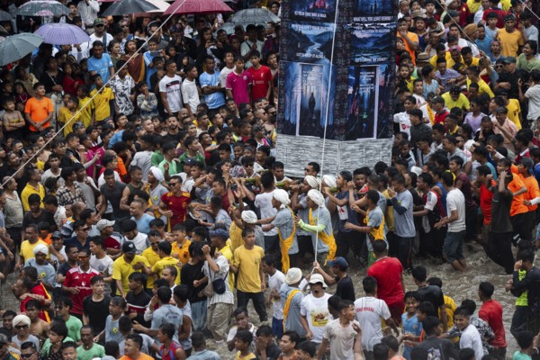 JOWAI, INDIA - JULY 14: People from the Pnar community march in a circle around a Rot as they
