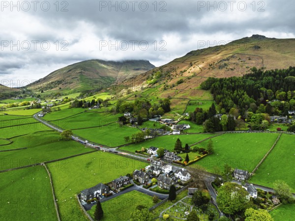 Farms and Mountains over road A591 from a drone, Grasmere Lake, Grasmere, Ambleside, Lake District,