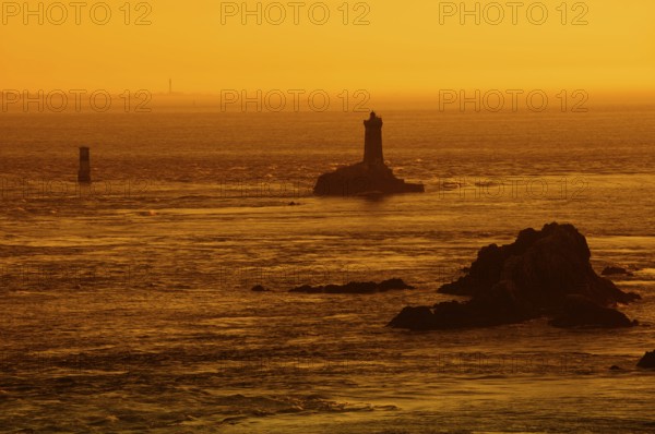 Phare de la Vieille lighthouse at sunset, Pointe du Raz, Cap Sizun, Finistere department, Brittany,