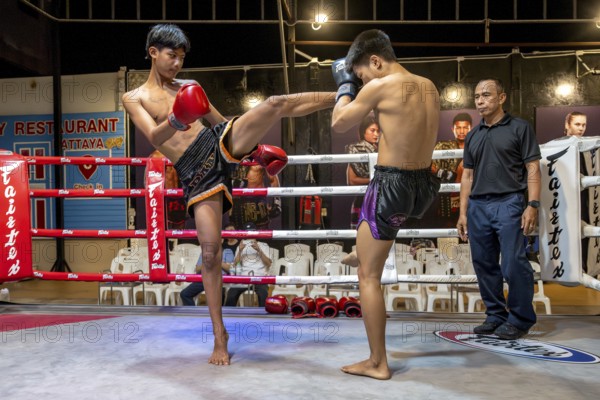 Thai boxing Muai Thai boxer in action, Pattaya, Thailand