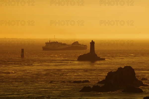 Phare de la Vieille lighthouse and ferryboat at sunset, Pointe du Raz, Cap Sizun, Finistere
