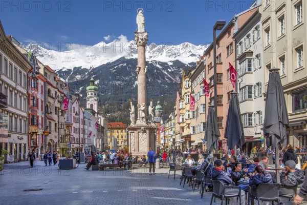 Pedestrian zone Maria-Theresien-Strasse with the Annasäule in front of the Nordkette of the