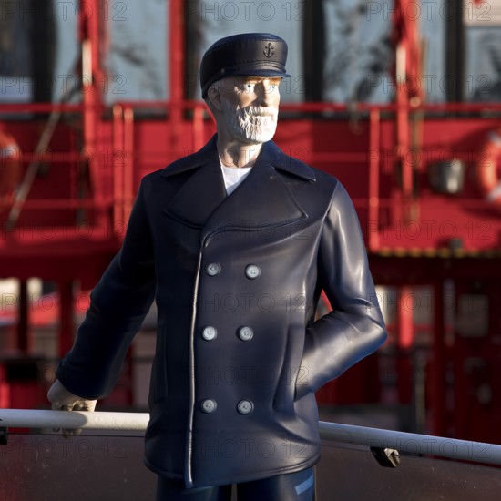 3-D figure of the captain permanently installed on the bow of the harbour ferry of line 62 in front
