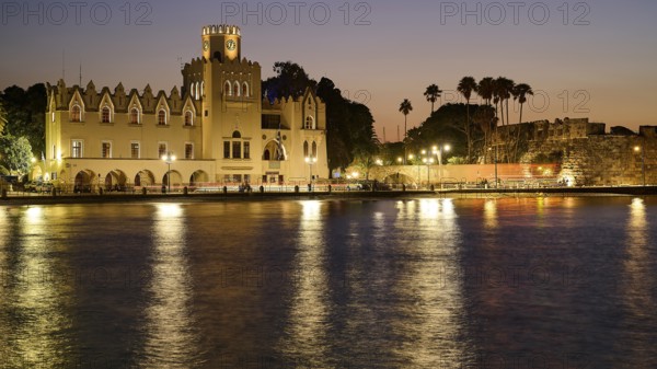 Palace of Justice, Colonial building, Historic building at night with lights and palm trees,