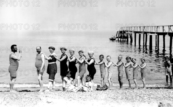 Beach, Baltic Sea, Summer holiday, In a row of organ pipes, 1920s, Group of people in striped