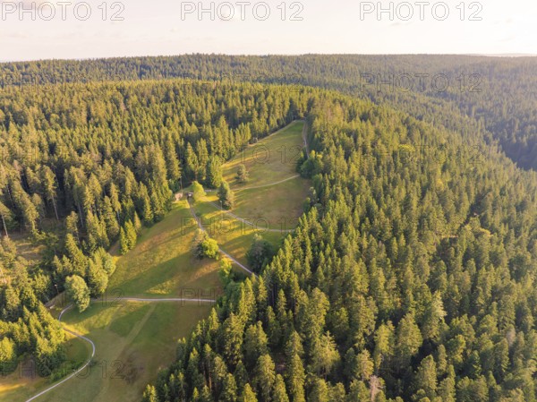 Overview of extensive slopes and forests in the soft light of day, Retro Freizeitpark Poppeltal