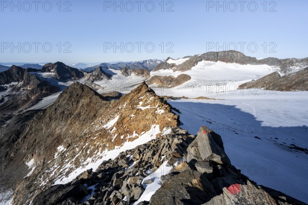 Rocky ridge on the Wilder Freiger mountain peak, behind Signal summit and Becher summit with