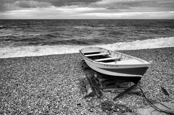 Boat, rowing boat, lies on the beach, pebble beach, Étretat, sea, clouds, black and white,