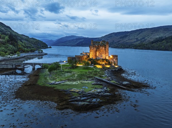 Night over Eilean Donan Castle and Loch Duich from a drone, Isle of Skye, Highlands, Scotland,
