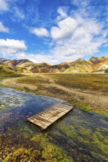 Volcanic landscape, colourful rhyolite mountains, ford, Cumulus, Landmannalaugar, remote hiking