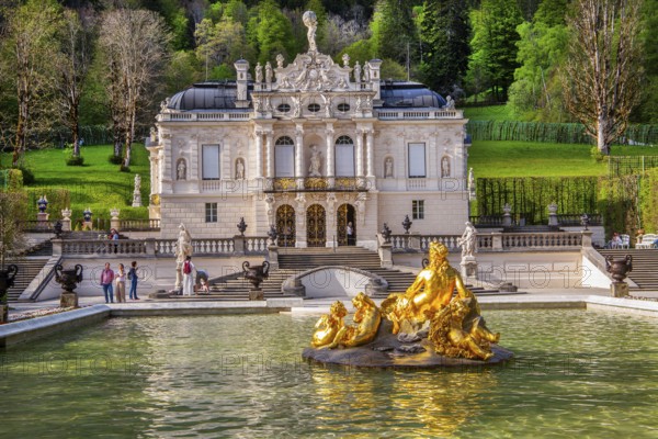 Water parterre with flora fountain and the portal of Linderhof Castle in spring, municipality of