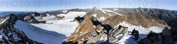 Mountain panorama at Wilder Freiger summit, picturesque high mountain landscape with snow, view of