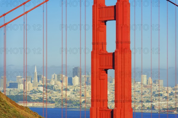 View of Golden Gate Bridge and financial district in the distance, San Francisco, California, USA