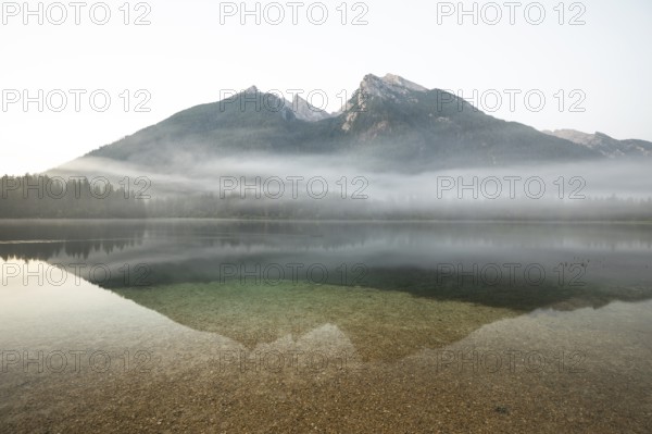 Magical sunrise with fog at Hintersee near Ramsau in Berchtesgadener Land