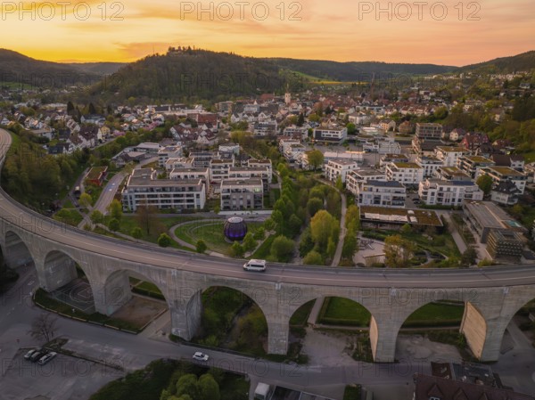 Panoramic view of a town with viaduct and buildings in the evening, Nagold, district of Calw,