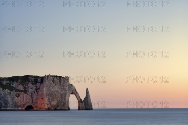 Rock arch Falaise or Porte d'Aval and rock needle Aiguille, illuminated, illuminated, Étretat, sea,