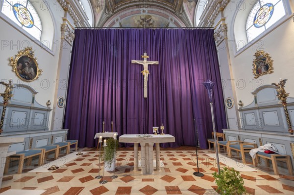Large purple Lenten cloth in front of the high altar in the baroque parish church of St Nicholas,