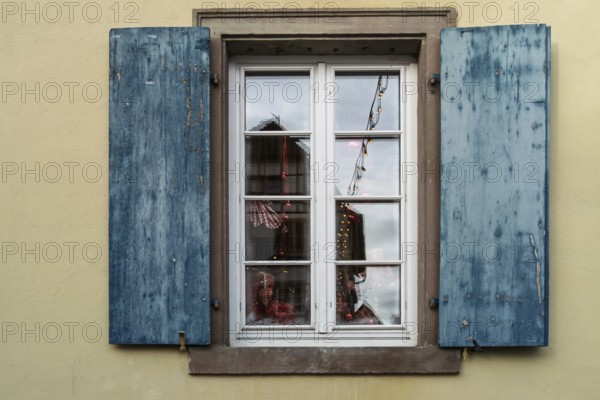 Window with blue shutters and reflections, Alsace, France