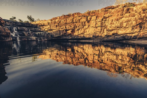 Bell Gorge waterfall, a body of water in north-west Australia in the Kimberley. Sunrise in the