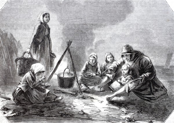Fishing family, parents with four children, having dinner on the coast of Andresselles, Pas de