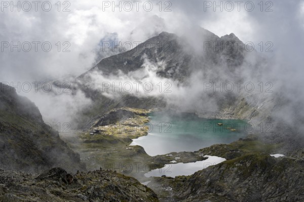 Mountain lakes Wangenitzsee and Kreuzsee, cloudy mountain peaks in the morning, Schober group, Hohe