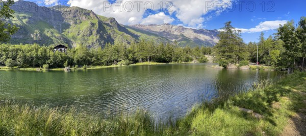 View of small picturesque romantic mountain lake Lago Grande near Moncenisio in Val Cenischia in