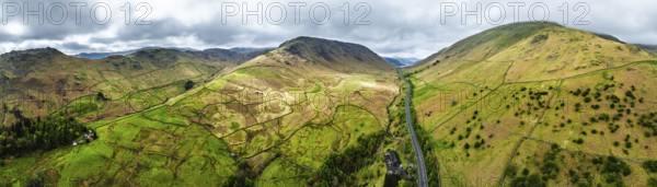 Panorama of Mountains over road A591 from a drone, Grasmere Lake, Grasmere, Ambleside, Lake