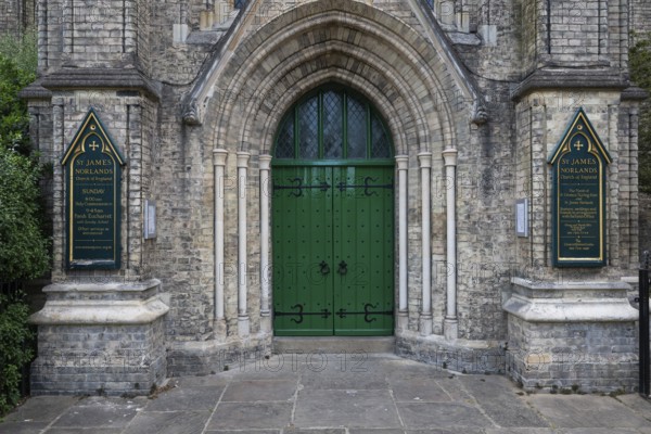 Neo-Gothic church entrance with green door, St James's Church, Norlands, architects Lewis Vulliamy,