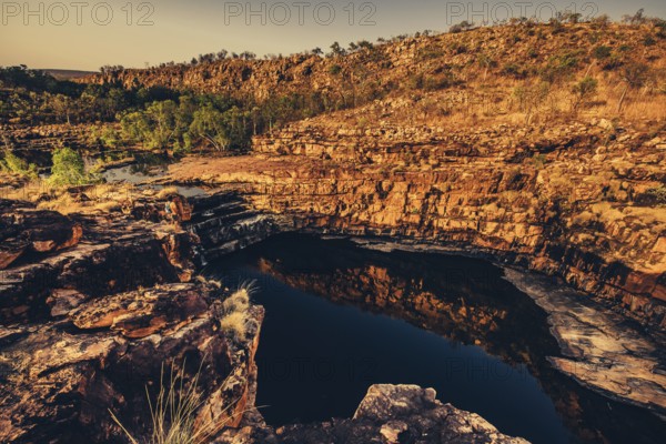 Bell Gorge waterfall, a body of water in north-west Australia in the Kimberley. Sunrise in the
