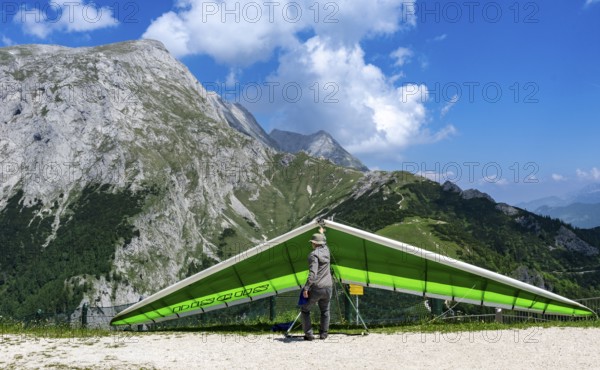 Paragliders preparing for flight, Jenner, Schönau am Königssee, Bavaria, Germany