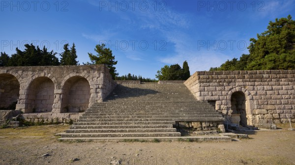 Stone staircase leads to ancient ruins, surrounded by sky and nature, open staircase to the second